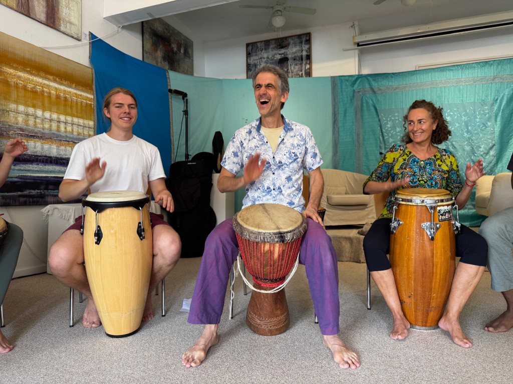 Three people with drums.